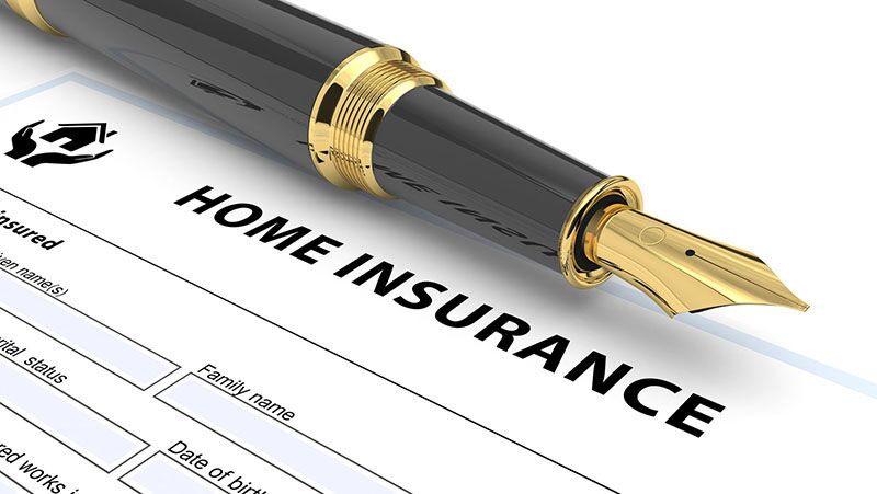 home insurance forms with a pen, what differentiates home insurance policies from home warranties